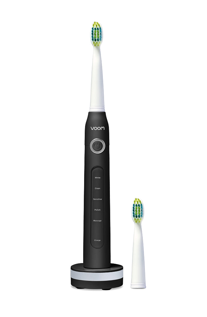 Black electric toothbrush with a white handle on a white background